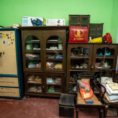 Wooden Shelf Filled With Artifacts Of Original Owner