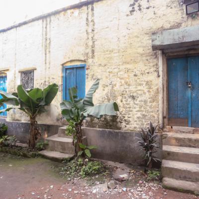 The Staff Quarter Has Several Doors With Stairs