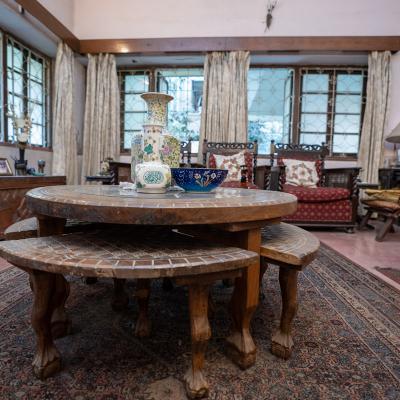 A Round Table With Seaters In The Living Area
