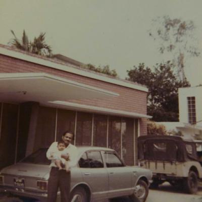 Old Family Photograph With Red Bricks On Outer Wall Of The House