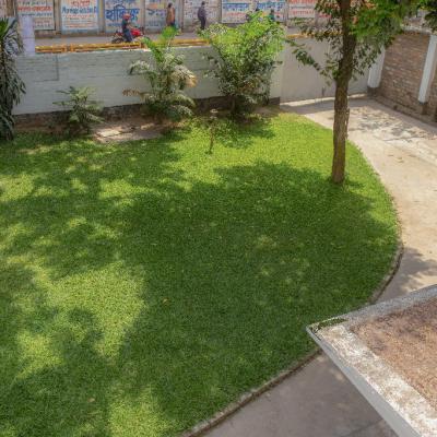 The Building Was Built At The Back Of The Property Keeping A Large Green Lawn On The South