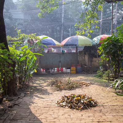 The Closed Gate Which Allows Street Vendors To Run Their Business On The Sidewalk